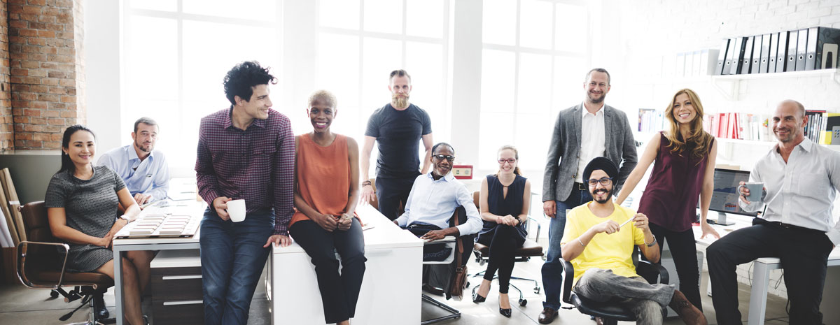 Stock photo of a diverse group of people sitting in an office.